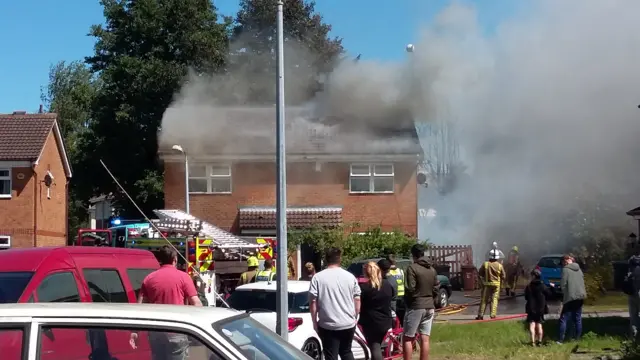 Fire engine and people around at the scene