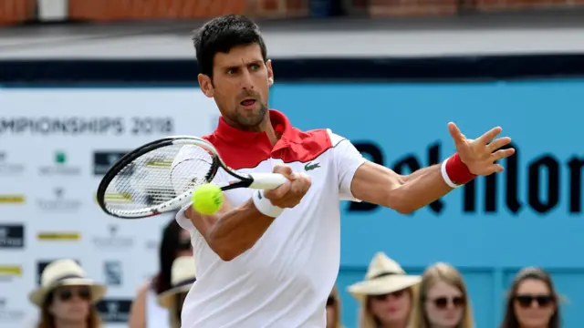 Djokovic hits a forehand