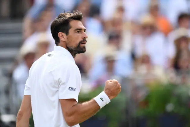 Chardy celebrates holding his serve