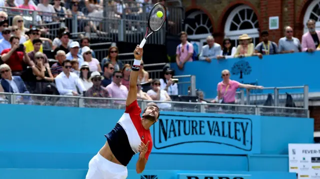 Marin Cilic serves during the second set