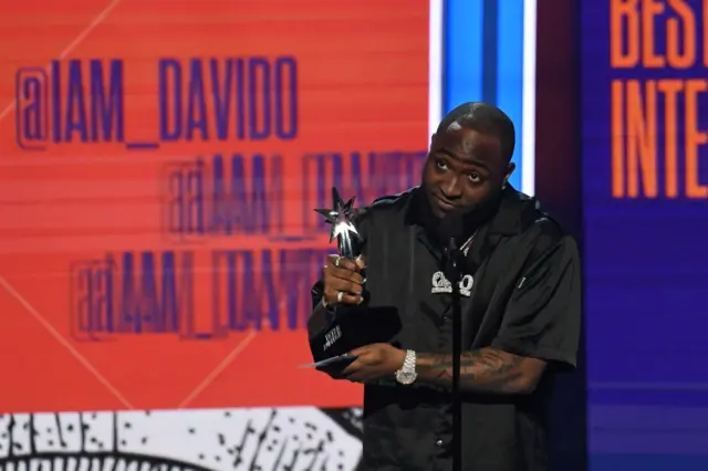 Davido accepts the award for best Best International Act during the BET Awards at Microsoft Theatre in Los Angeles, California, on June 24, 2018