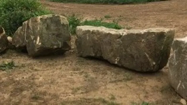 Rocks placed outside fields