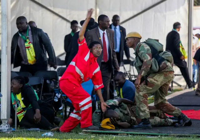 Medics attend to people injured in an explosion during a rally by Zimbabwean President Emmerson Mnangagwa in Bulawayo, Zimbabwe June 23, 2018