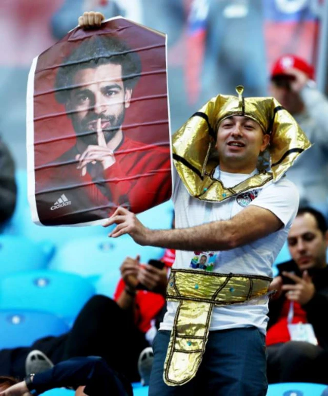 Fans with Salah poster