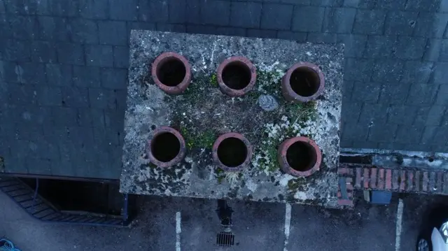 A nest spotted next to a chimney by a drone