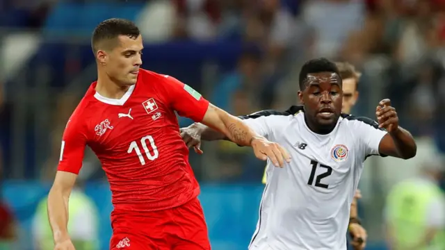 Switzerland's Granit Xhaka (left) in action