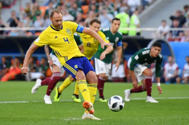 Andreas Granqvist of Sweden scores his team's second goal from the penalty spot