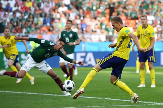 Ludwig Augustinsson of Sweden scores his team's first goal