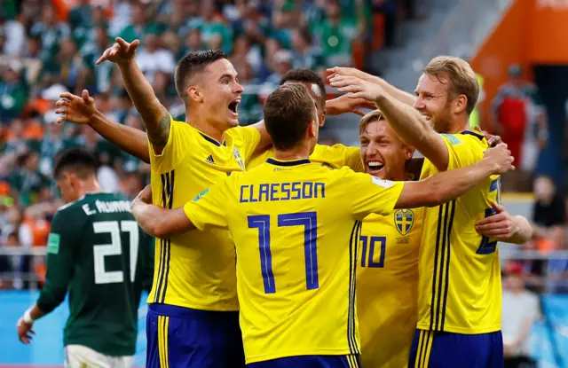 Sweden's Mikael Lustig, Viktor Claesson, Emil Forsberg and team mates celebrate after Mexico's Edson Alvarez scored Sweden's third with an own goal