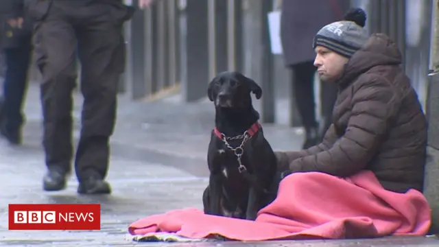 Homelss chap with dog