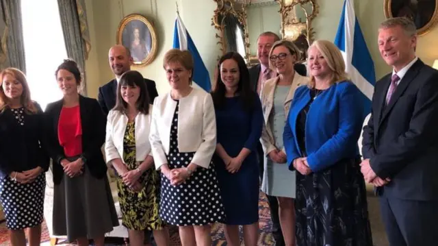 Image caption Nicola Sturgeon greeted her new ministers at Bute House