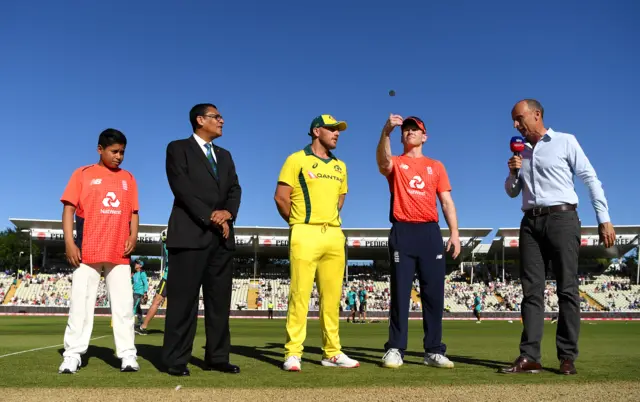 England captain Eoin Morgan tosses the coin alongside Australia captain Aaron Finch