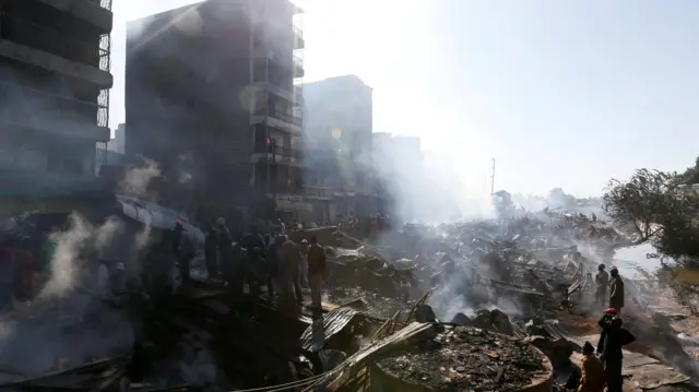 The smouldering scene of fire that gutted  Gikomba market, Nairobi, Kenya - 28 June 2018