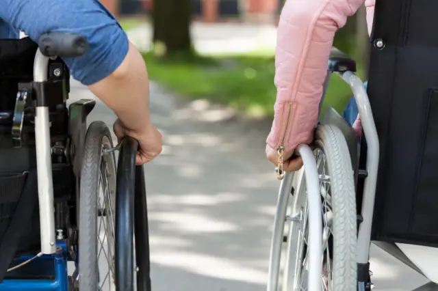 Two wheelchair users