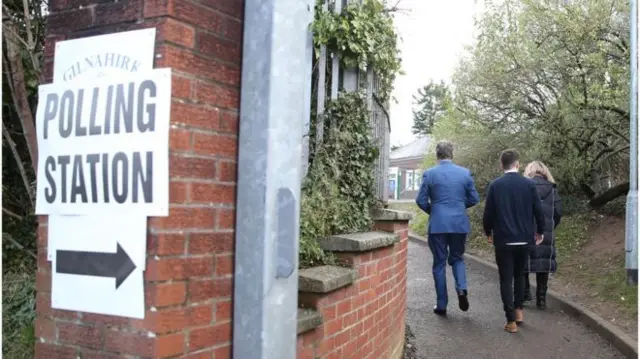 voters at a polling station