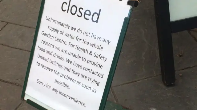 Sign saying restaurant closed due to lack of water