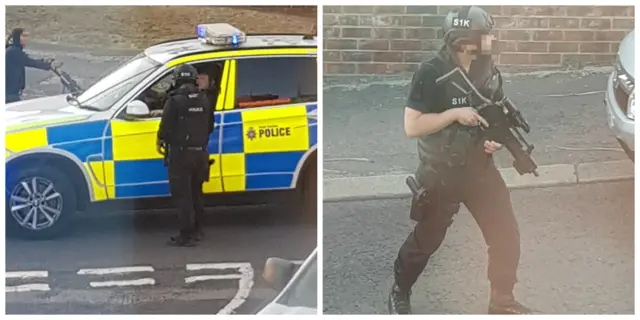 Police car and armed police on a road