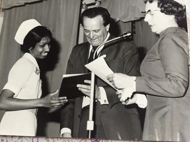 Nirmala receiving her state enrolled nurse qualification in 1976 from a councillor and "scary" matron Miss Young