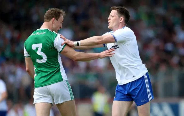 Che Cullen and Conor McManus indulge is a spot of push, shove and pull at Healy Park