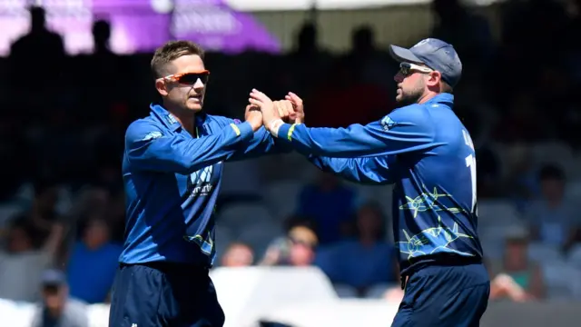 Joe Denly celebrates taking the wicket of Liam Dawson