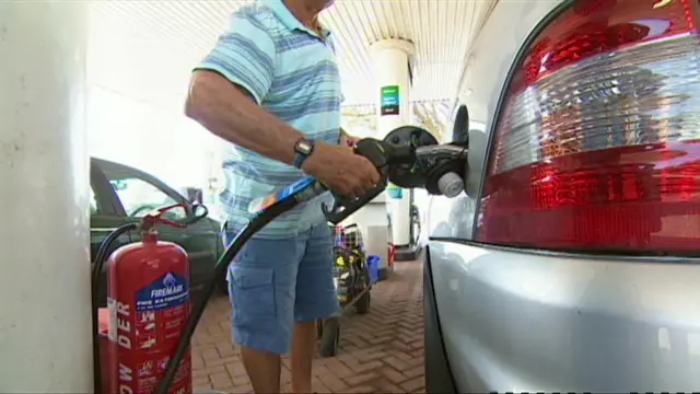 Man filling up his car with fuel