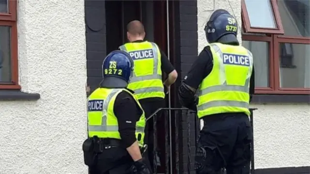 Police entering house