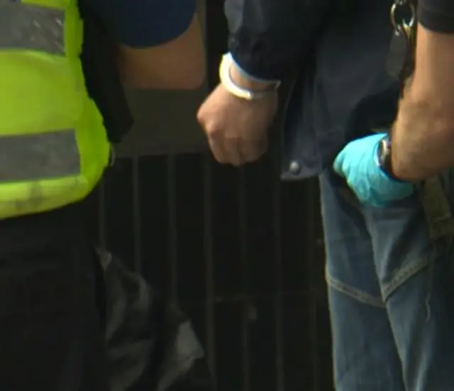 Officers handcuffing unidentified person in Hull City Centre