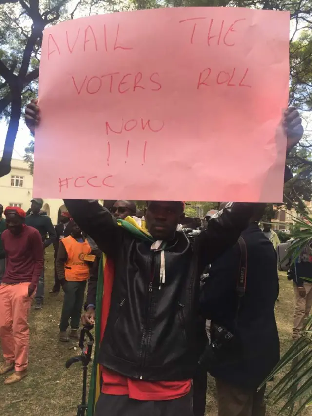 Supporters of Zimbabwe's opposition MDC party demonstrate with banners