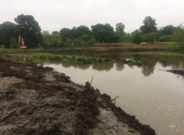 View of partly dredged lake