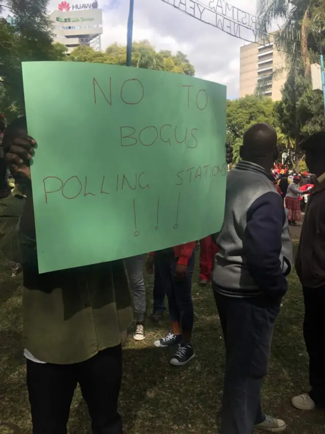 Supporters of Zimbabwe's opposition MDC party demonstrate with banners