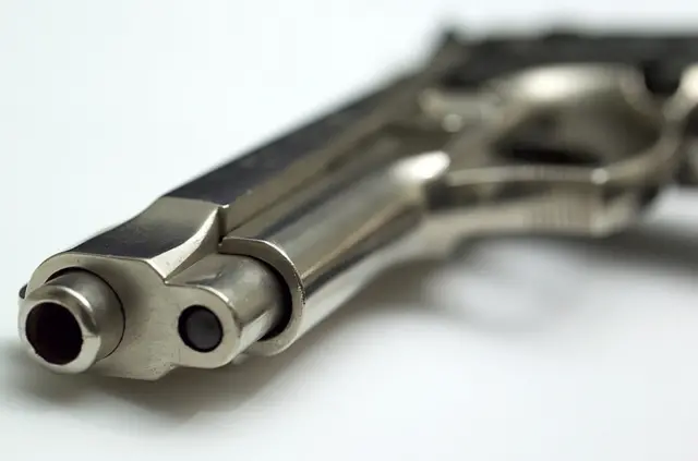 Barrel of a pistol.