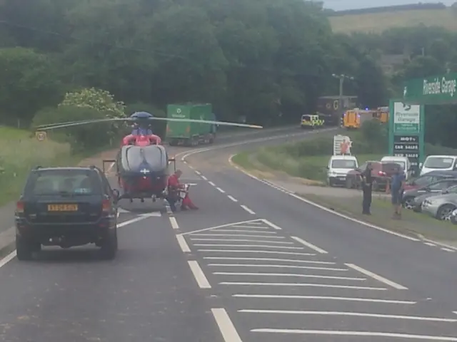 Air ambulance at scene of crash on A38