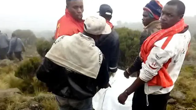 Rescue workers at the scene of a plane crash in the Aberdares, Kenya