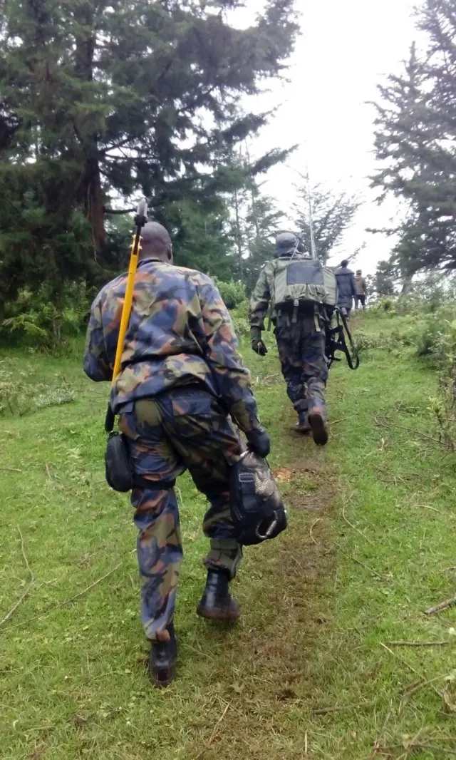 Soldiers walking up the Abedare mountains, Kenya