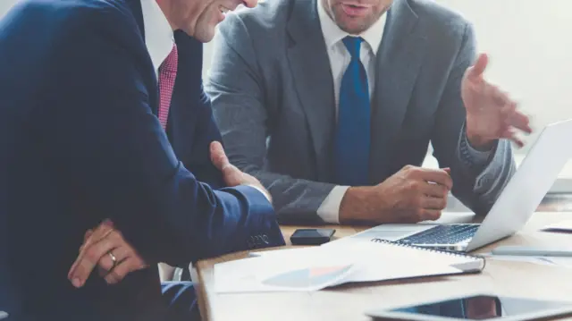 Two men in a meeting