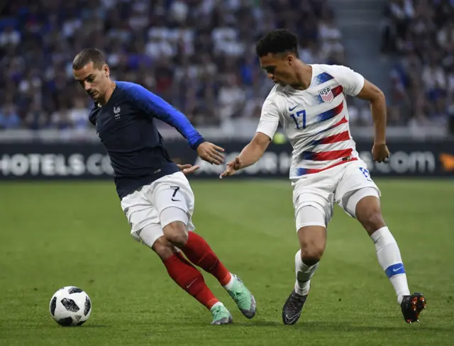 Antoine Griezmann (L) vies with USA's defender Antonee Robinson