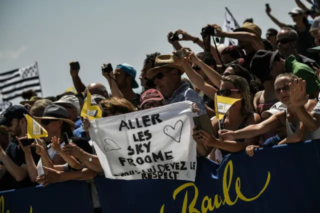 Tour de France spectators hold up a banner in support of Chris Froome