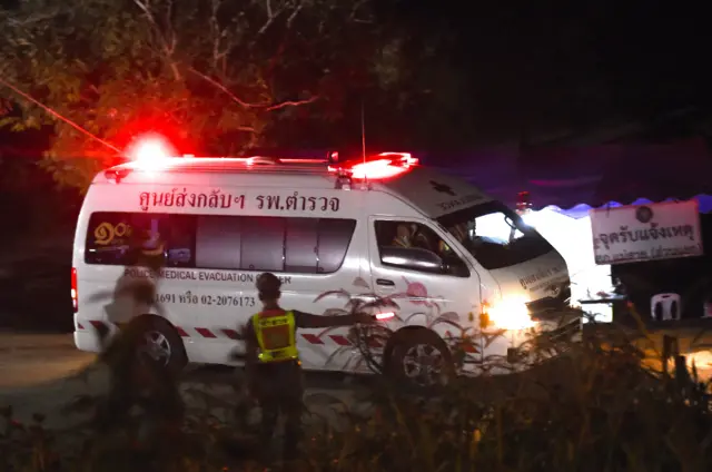 An ambulance leaves the Tham Luang cave on Tuesday