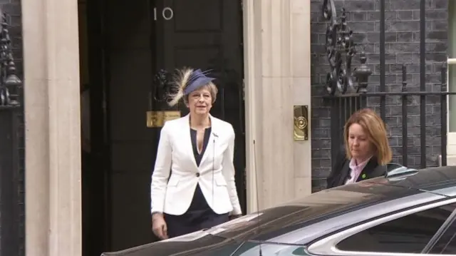 Theresa May leaves No 10 wearing a fascinator