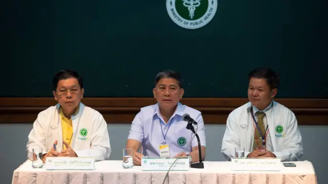 Three doctors giving press conference