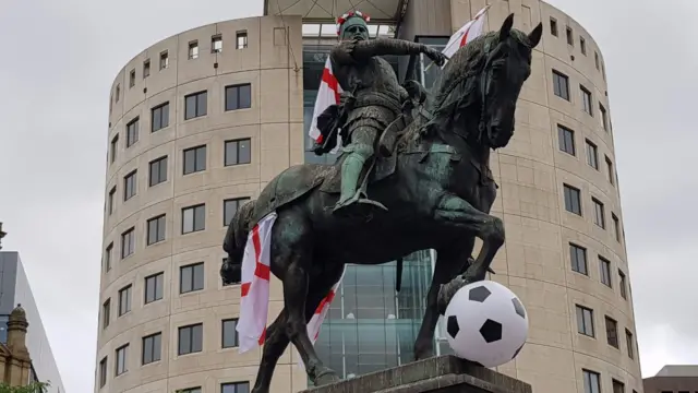 Black horse wearing England flags