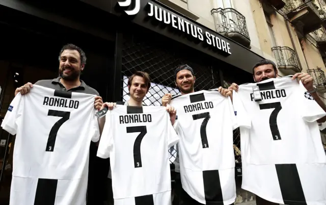 Juventus fans with Ronaldo shirts