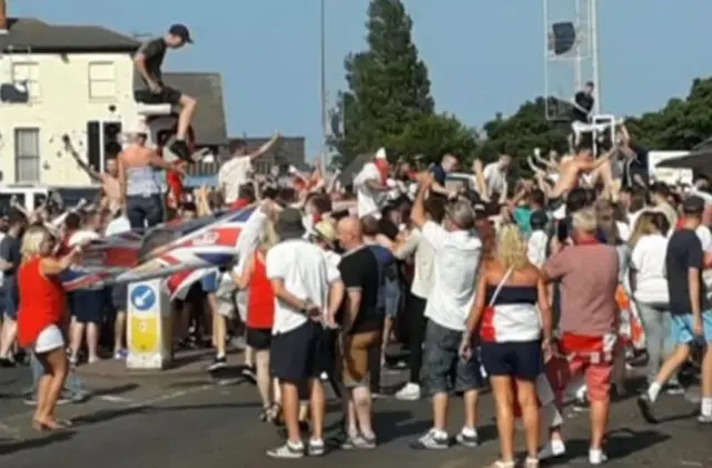 Fans climbing on things.