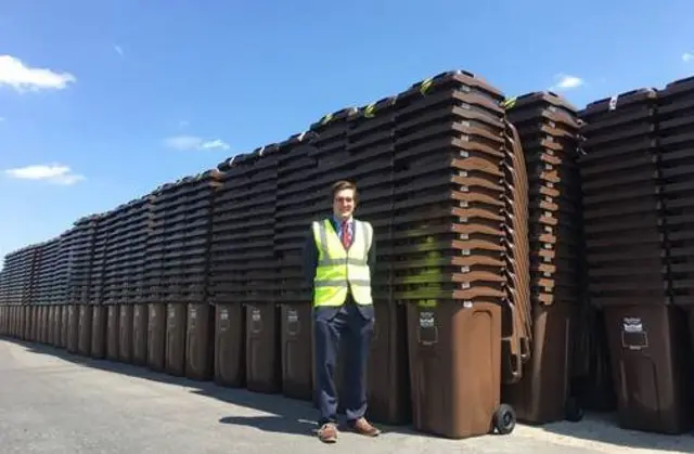 Councillor Lewis Dagnall near some bins