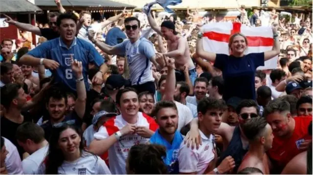 Fans watching the England match.