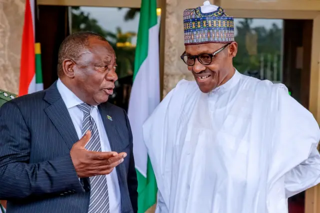 Cyril Ramaphosa speaks to Muhammadu Buhari at the State House in Abuja, Nigeria July 11, 2018