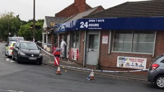 Police tape outside shop in Stainforth