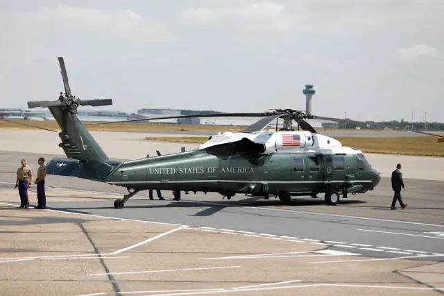 One of two US military helicopters waiting on the tarmac