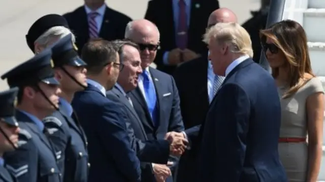 Liam Fox shakes hands with Donald Trump