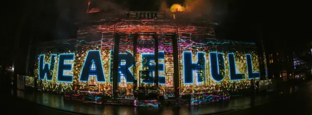 The words 'We Are Hull' projected onto a building.